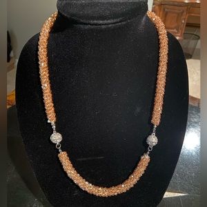Beautiful peach color crystal necklace and bracelet set.